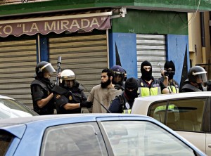 Spanish police officers arresting a suspect on Friday in Melilla, a Spanish enclave in North Africa. Photo: F. G. Guerrero European Pressphoto 