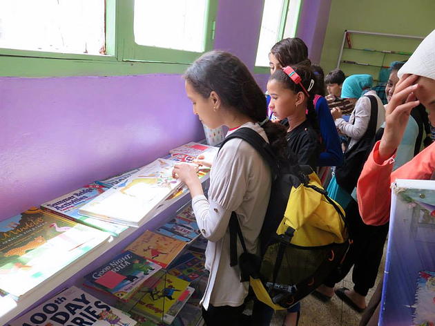 Students perusing the collection at the Erfoud English library.
