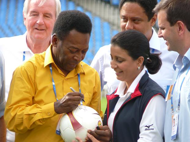 Pele signs a soccer ball for Nawal El Moutawakel - Photo by Around the rings1992