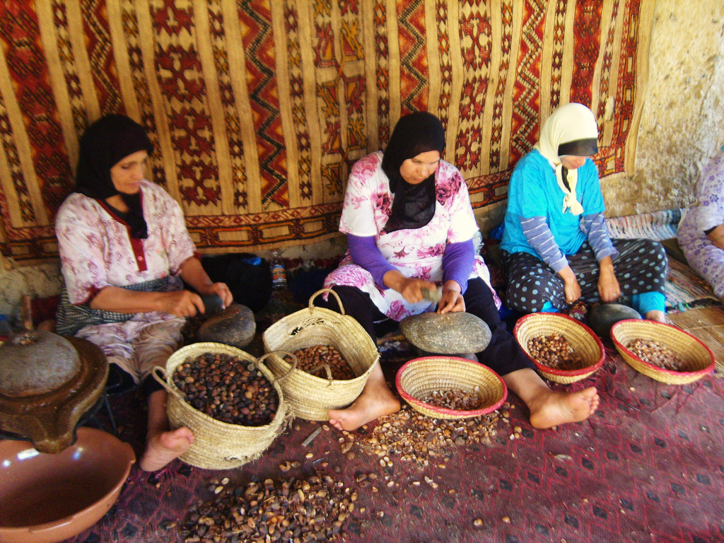 Women processing argan seeds in Morocco. Photo by "Jessica on Paper" on Flickr.